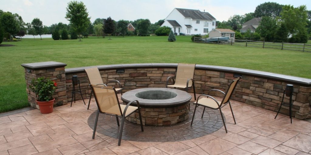 custom fire pit, stamped concrete, seating wall