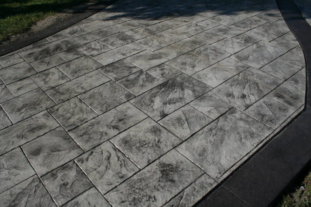 Gray and Black Stamped Concrete Driveway with random slate pattern