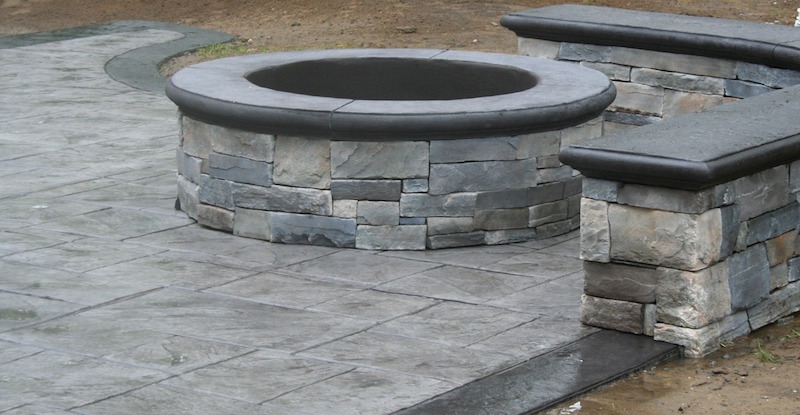 stamped concrete patio with custom fire pit in Fair Haven NJ