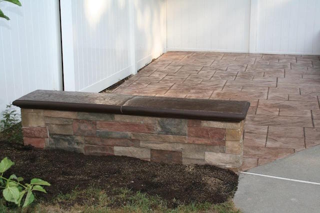 retaining wall on stamped concrete patio