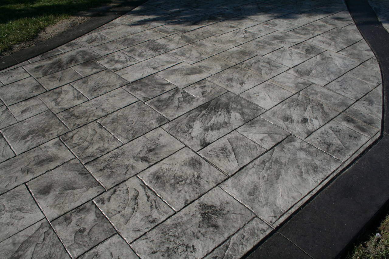 Gray and Black Stamped Concrete Slate Pattern Driveway bluetsone